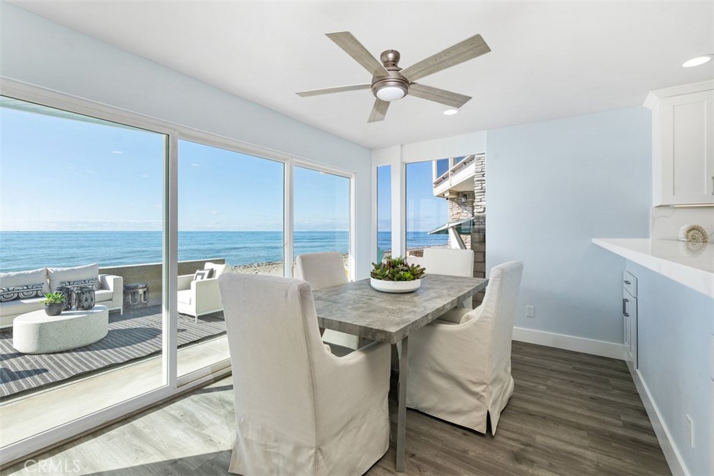 35261 Beach Road Dana Point, CA 92624 - Photo 12 of 45 a view of a dining room with furniture window and wooden floor
