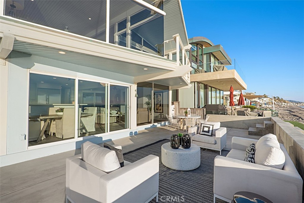 35261 Beach Road Dana Point, CA 92624 - Photo 13 of 45 a view of living room and patio furniture and floor to ceiling window