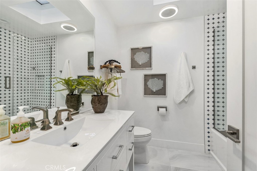 35261 Beach Road Dana Point, CA 92624 - Photo 20 of 45 a bathroom with a sink toilet and shower