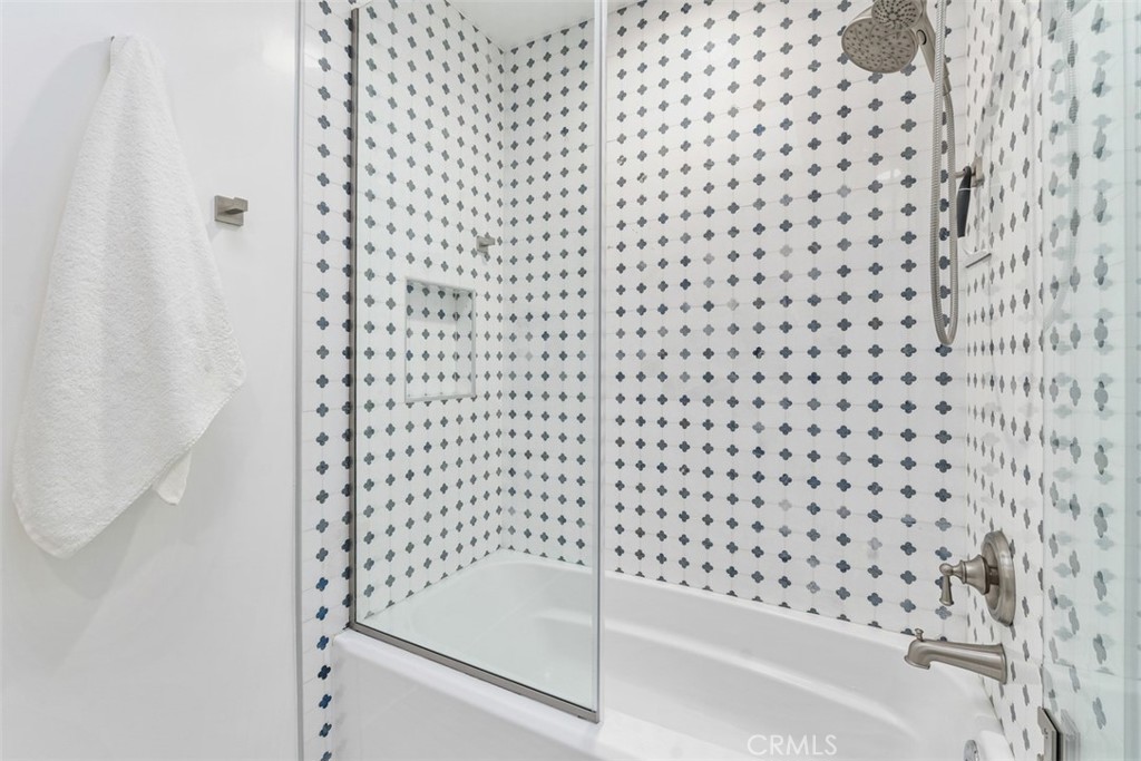 35261 Beach Road Dana Point, CA 92624 - Photo 21 of 45 a bathroom with a bathtub and shower