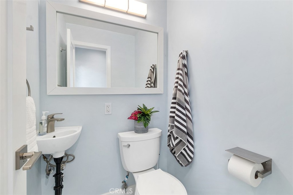 35261 Beach Road Dana Point, CA 92624 - Photo 22 of 45 a bathroom with a sink mirror toilet and vanity