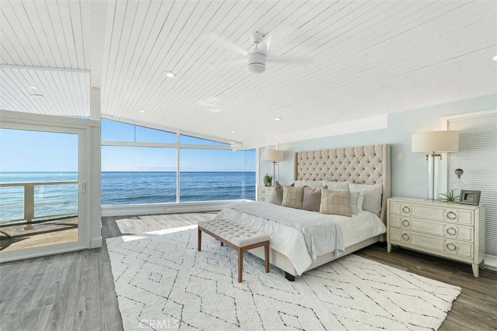35261 Beach Road Dana Point, CA 92624 - Photo 23 of 45 a bedroom with a bed and a large window