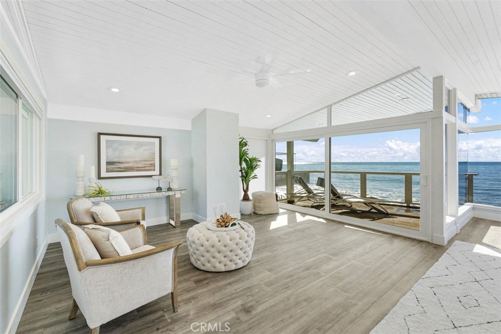 35261 Beach Road Dana Point, CA 92624 - Photo 26 of 45 a living room with furniture and large windows