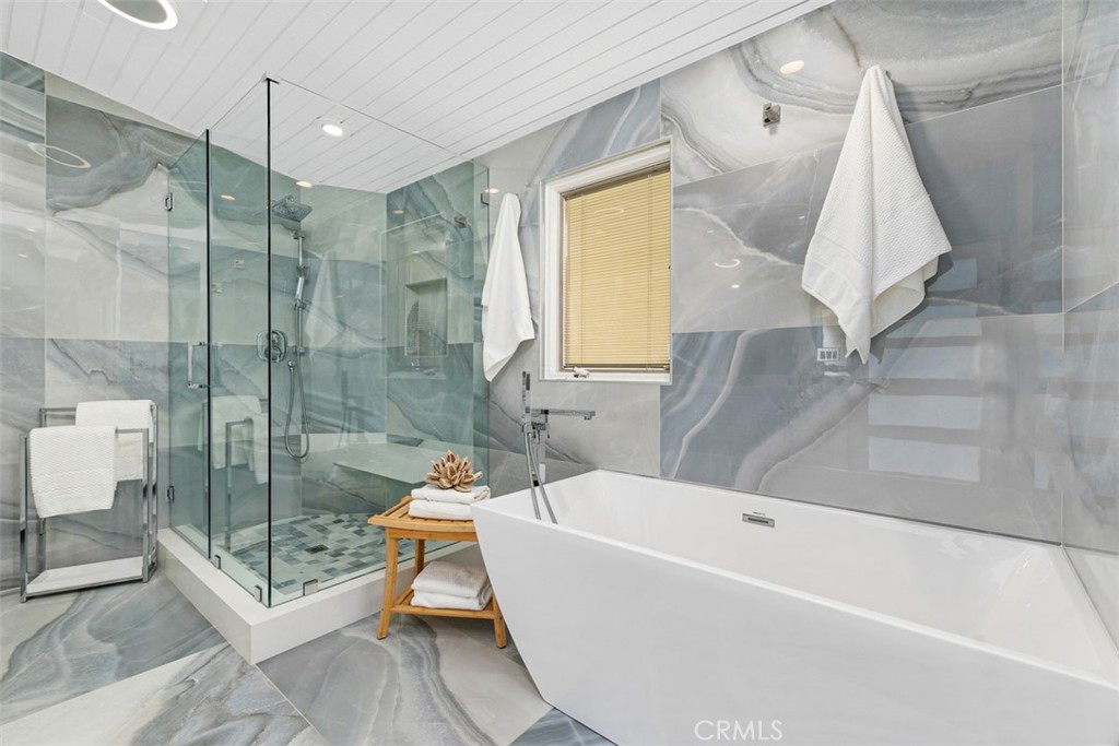 35261 Beach Road Dana Point, CA 92624 - Photo 29 of 45 a bathroom with a bathtub and a shower