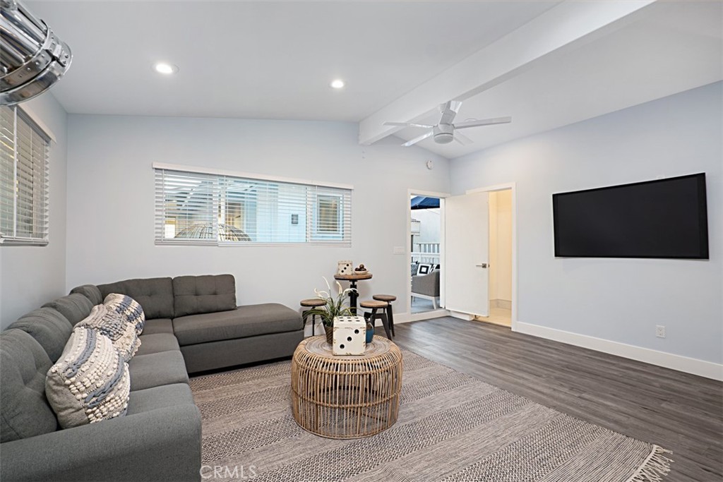 35261 Beach Road Dana Point, CA 92624 - Photo 34 of 45 a living room with furniture and a flat screen tv