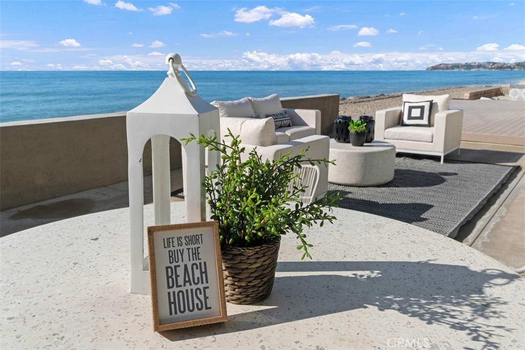 35261 Beach Road Dana Point, CA 92624 - Photo 44 of 45 a front view of a house with outdoor seating
