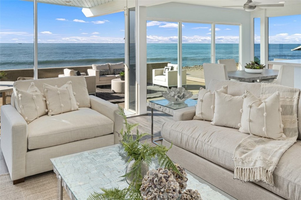 35261 Beach Road Dana Point, CA 92624 - Photo 5 of 45 a living room with furniture and a floor to ceiling window