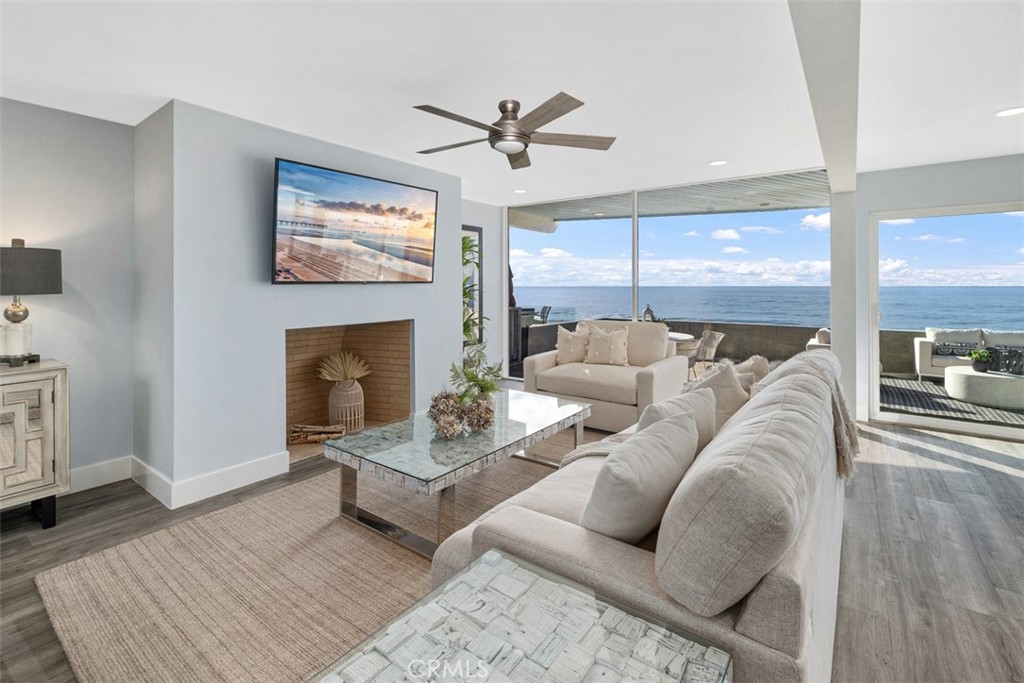 35261 Beach Road Dana Point, CA 92624 - Photo 6 of 45 a living room with furniture fireplace and wooden floor