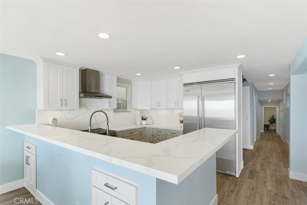 35261 Beach Road Dana Point, CA 92624 - Photo 9 of 45 a kitchen with stainless steel appliances a sink and a refrigerator