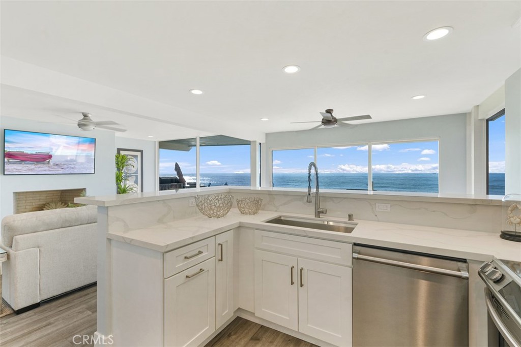 35261 Beach Road Dana Point, CA 92624 - Photo 10 of 45 a kitchen with a sink cabinets and window