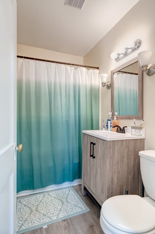 26 King Philip Road Worcester, MA 01606 - Photo 15 of 16 a bathroom with a sink a mirror and a toilet