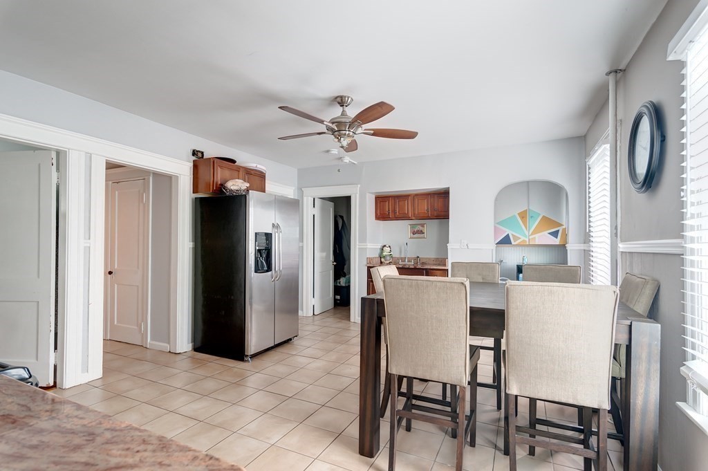 26 King Philip Road Worcester, MA 01606 - Photo 6 of 16 a view of a dining room with furniture and a chandelier fan