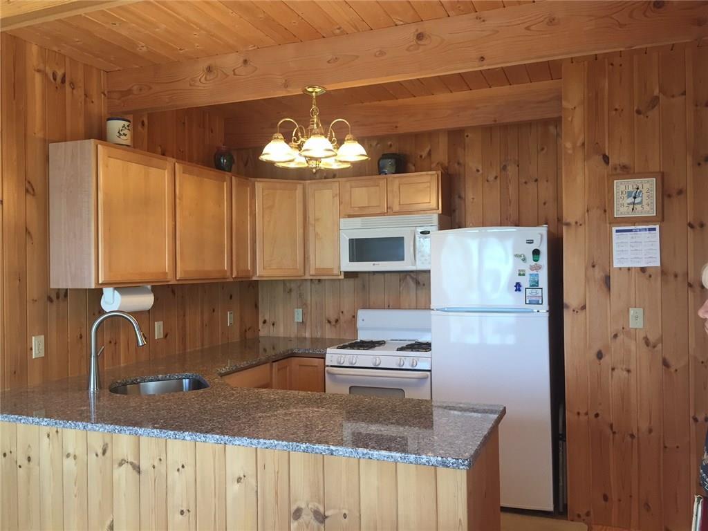 325 Ripley Road Harrington, ME 04643 - Photo 10 of 22 KITCHEN with knotty pine
