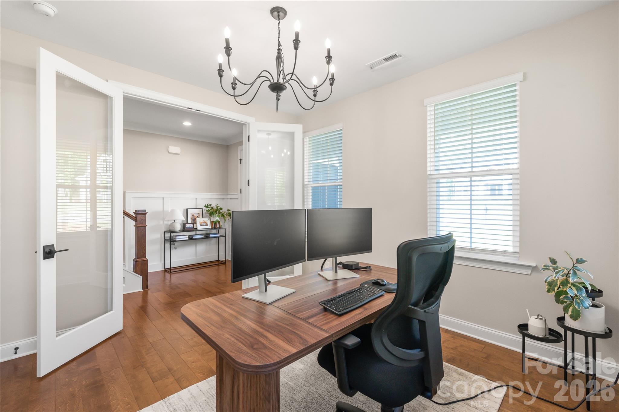 3213 Timber Run Lane Maiden, NC 28650 - Photo 10 of 47 a view of a workspace with furniture and a chandelier
