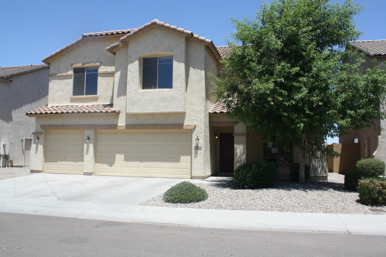 5114 West Apollo Road Laveen, AZ 85339 - Photo 1 of 17 a front view of a house