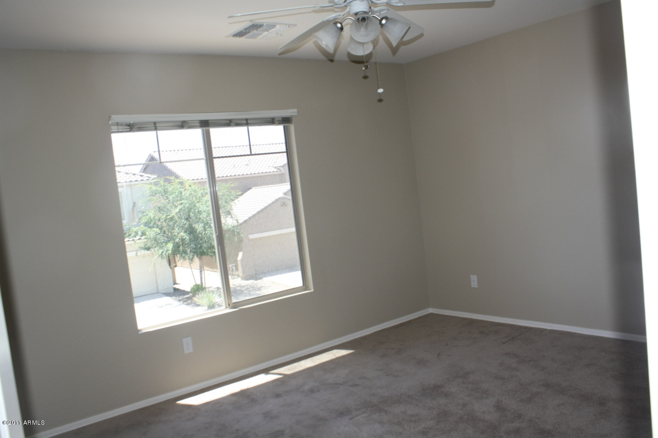 5114 West Apollo Road Laveen, AZ 85339 - Photo 16 of 17 an empty room with a window