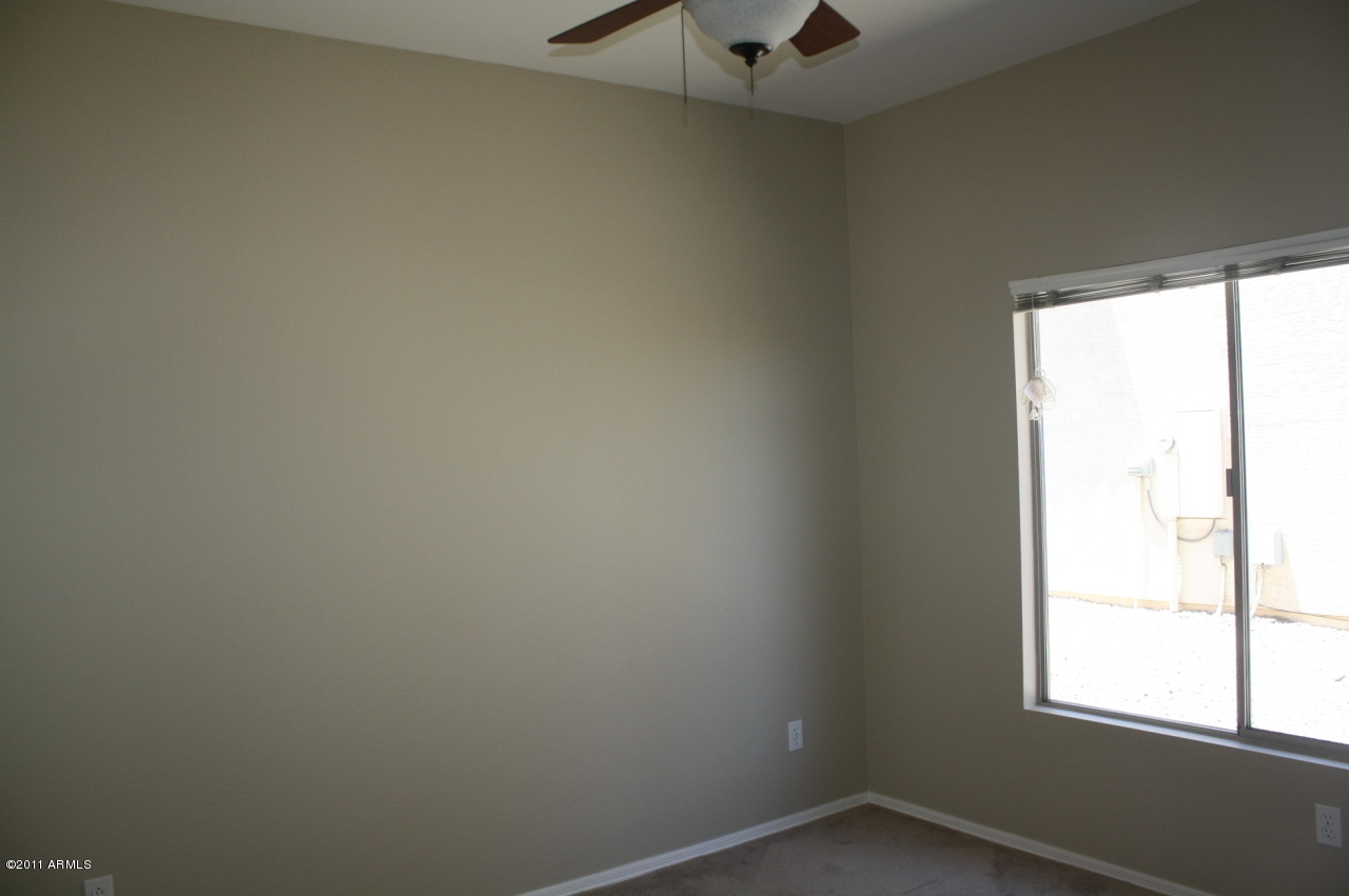 5114 West Apollo Road Laveen, AZ 85339 - Photo 6 of 17 an empty room with a window