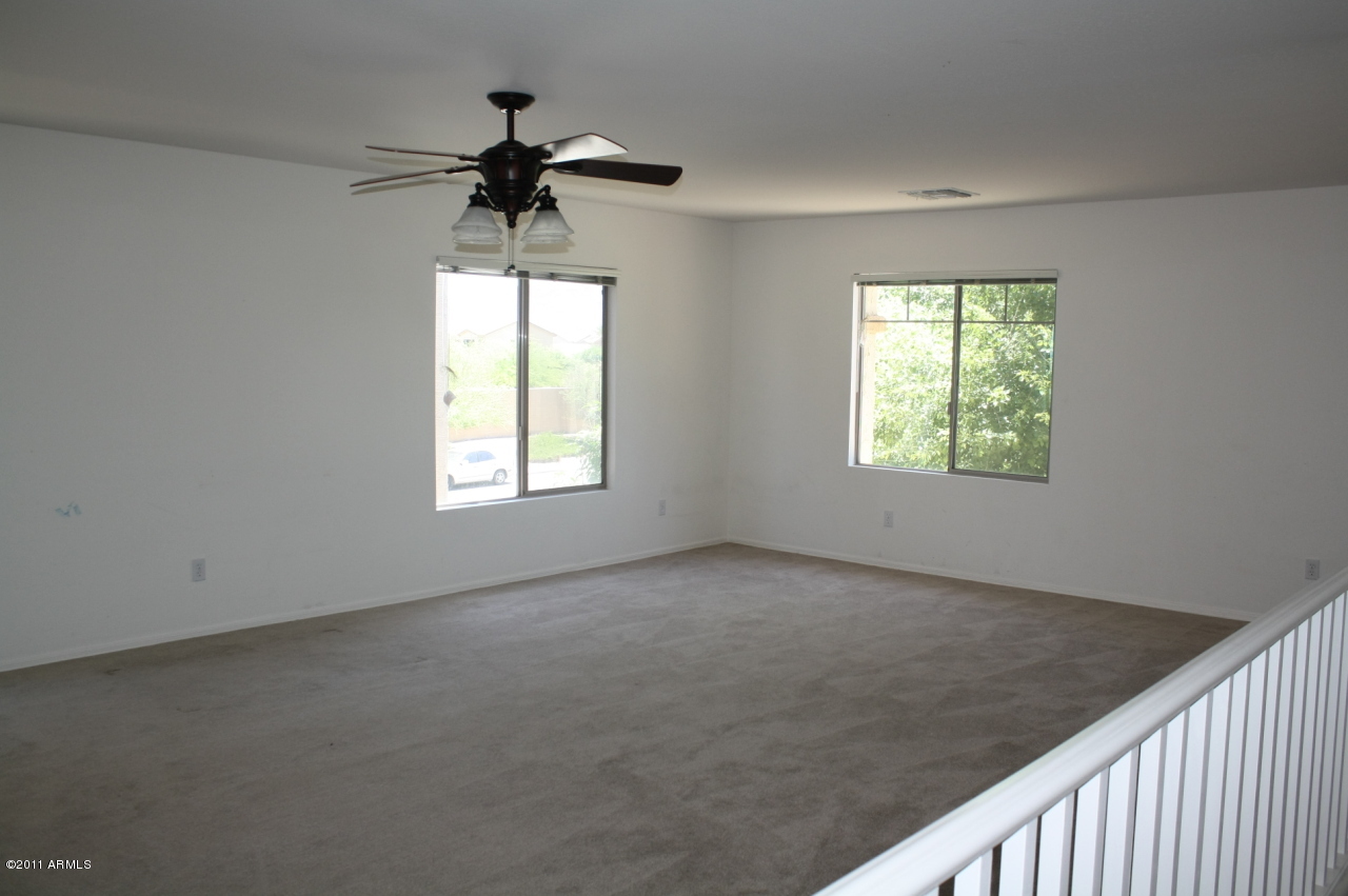 5114 West Apollo Road Laveen, AZ 85339 - Photo 10 of 17 an empty room that has a window