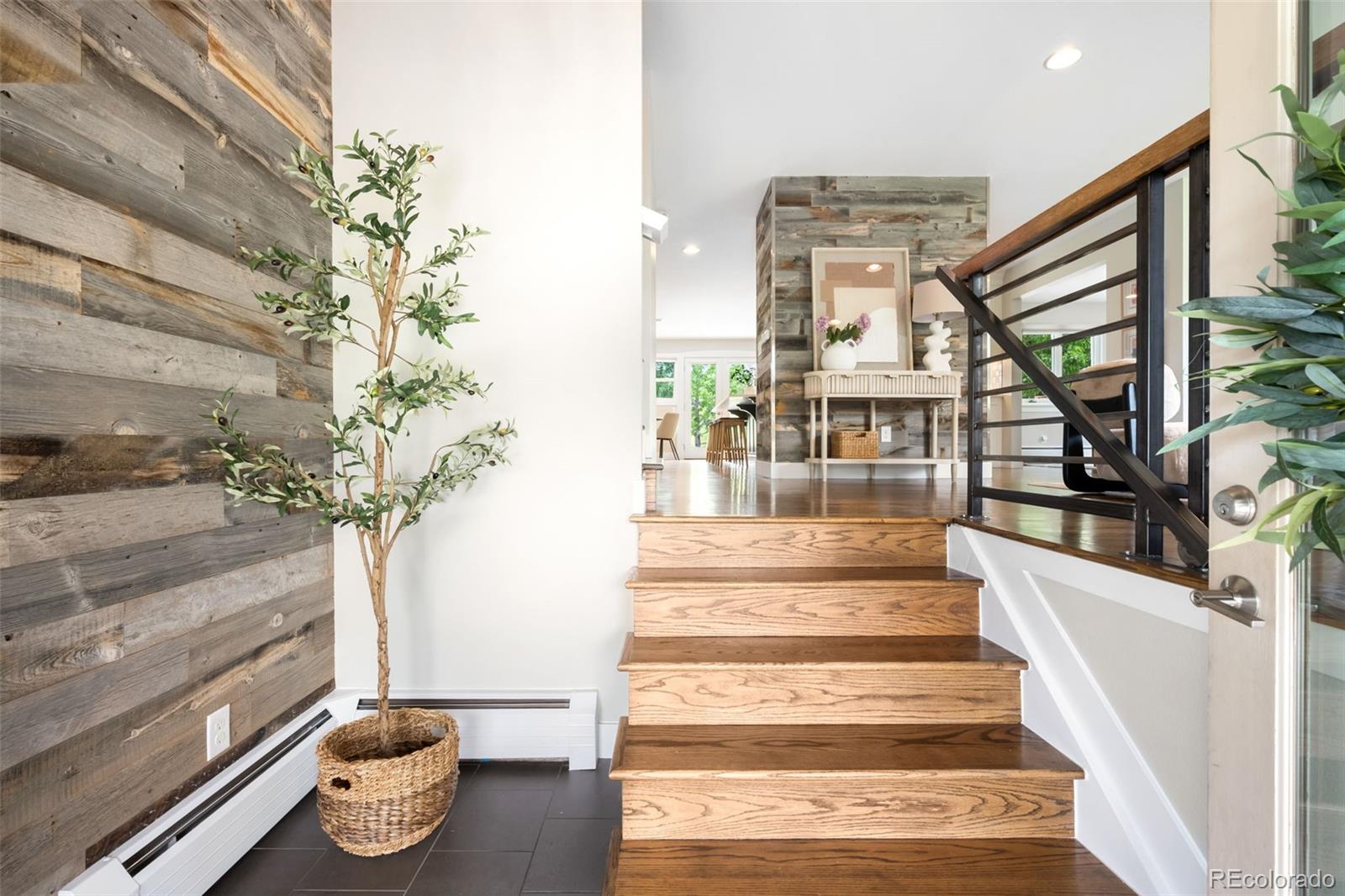 5586 Colorow Drive Morrison, CO 80465 - Photo 4 of 50 a view of staircase with white walls and a potted plant