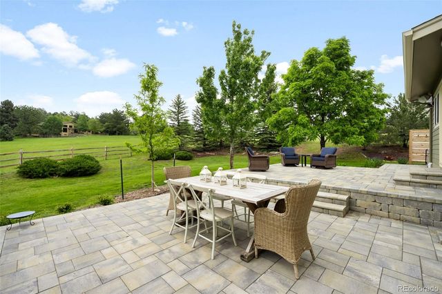 a view of a dining space with a table and chairs