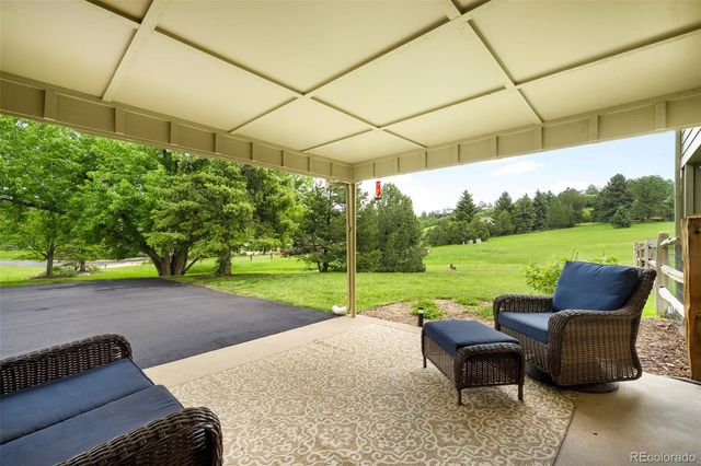 a view of a patio with chair and table