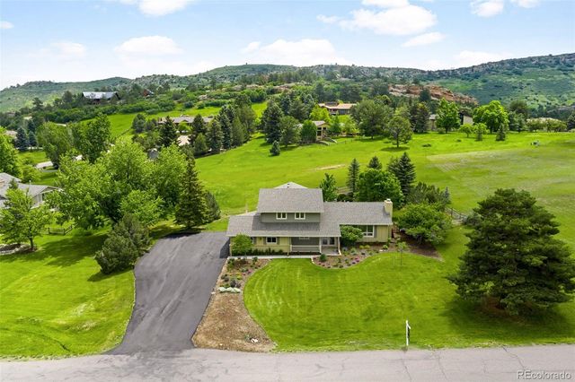 a view of a garden with houses