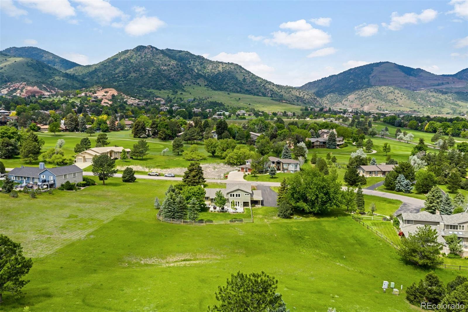 5586 Colorow Drive Morrison, CO 80465 - Photo 48 of 50 a view of a lush green hillside and houses