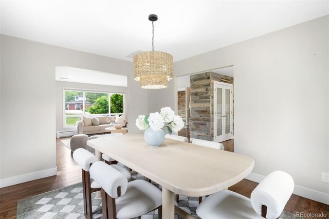 a view of a dining room with furniture window and wooden floor