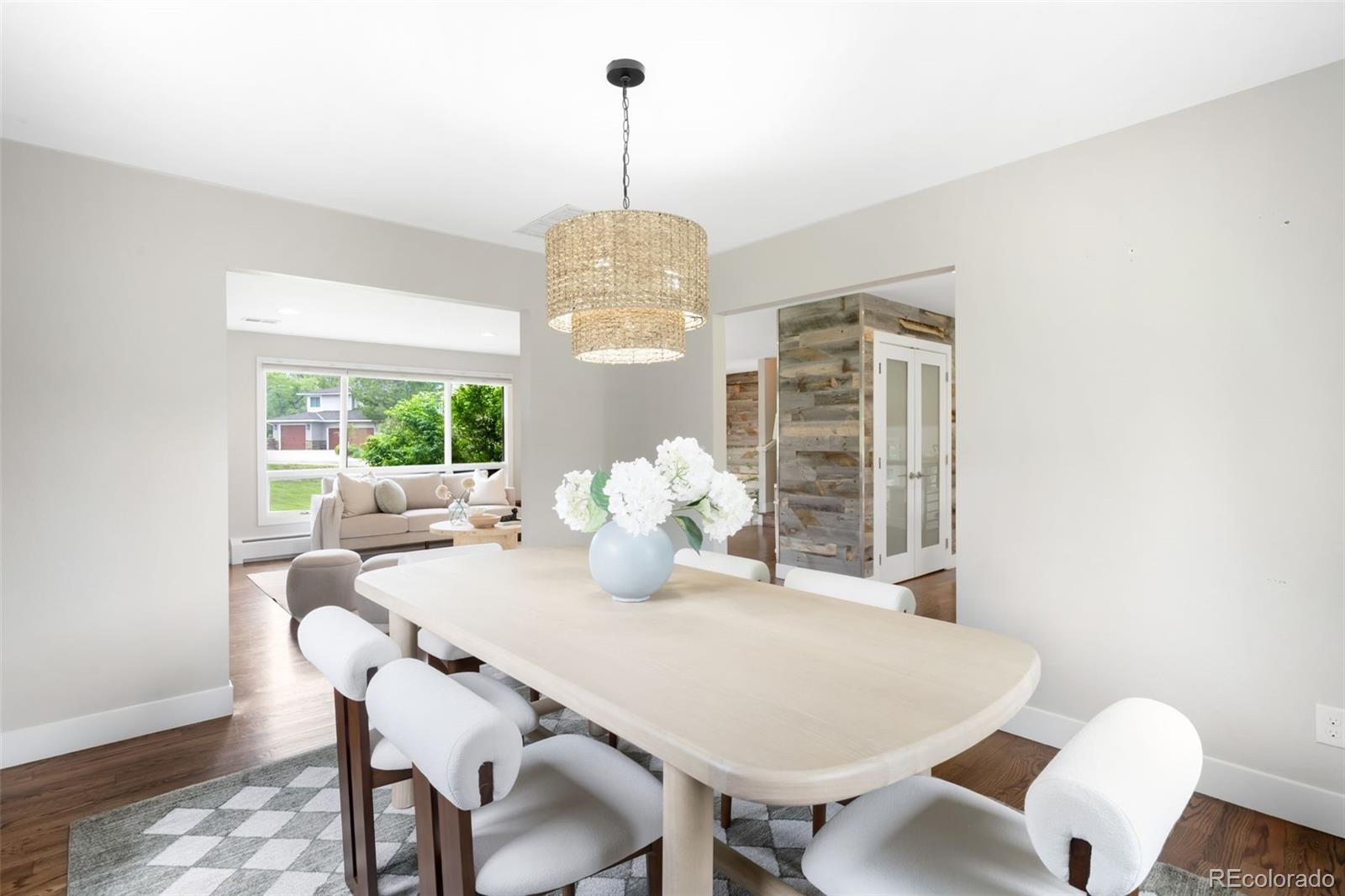 5586 Colorow Drive Morrison, CO 80465 - Photo 9 of 50 a view of a dining room with furniture window and wooden floor