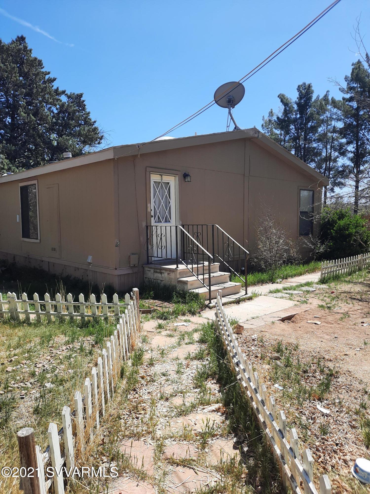 3965 Beaver Lane Rimrock, AZ 86335 - Photo 1 of 10 a front view of a house with a yard