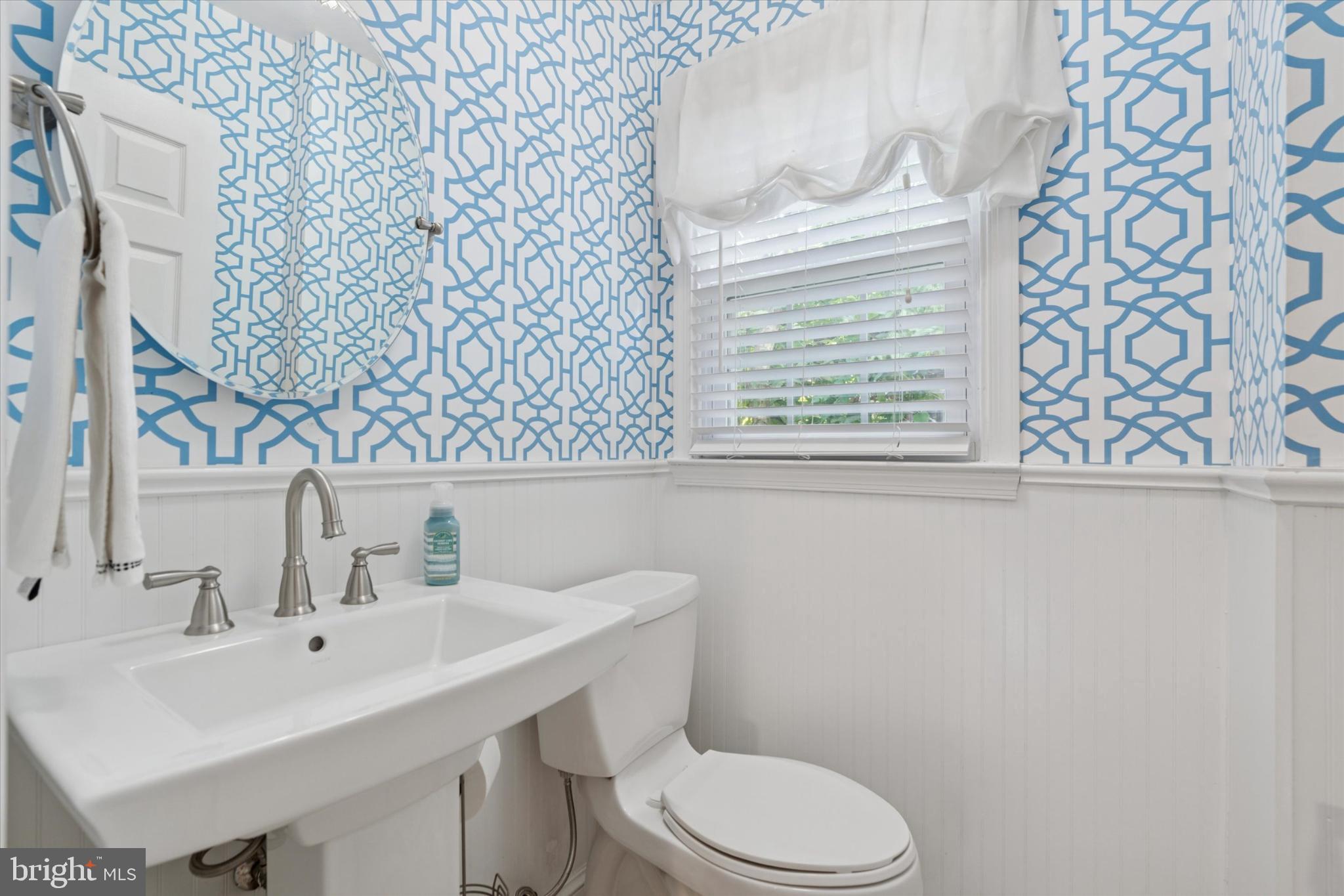 101 Rockland Road Havertown, PA 19083 - Photo 18 of 35 a bathroom with a sink a toilet and a mirror
