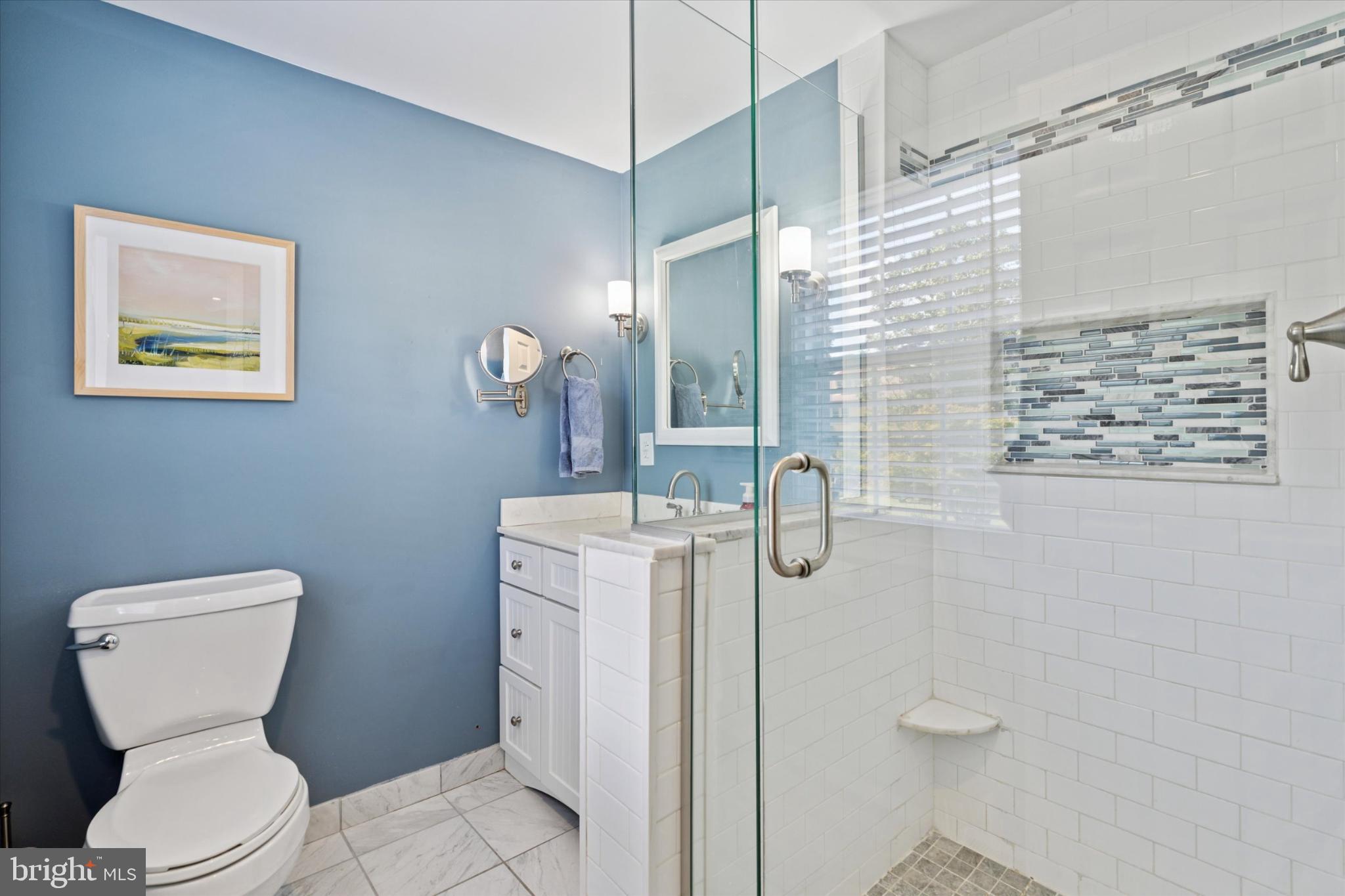 101 Rockland Road Havertown, PA 19083 - Photo 23 of 35 a bathroom with a toilet sink and mirror