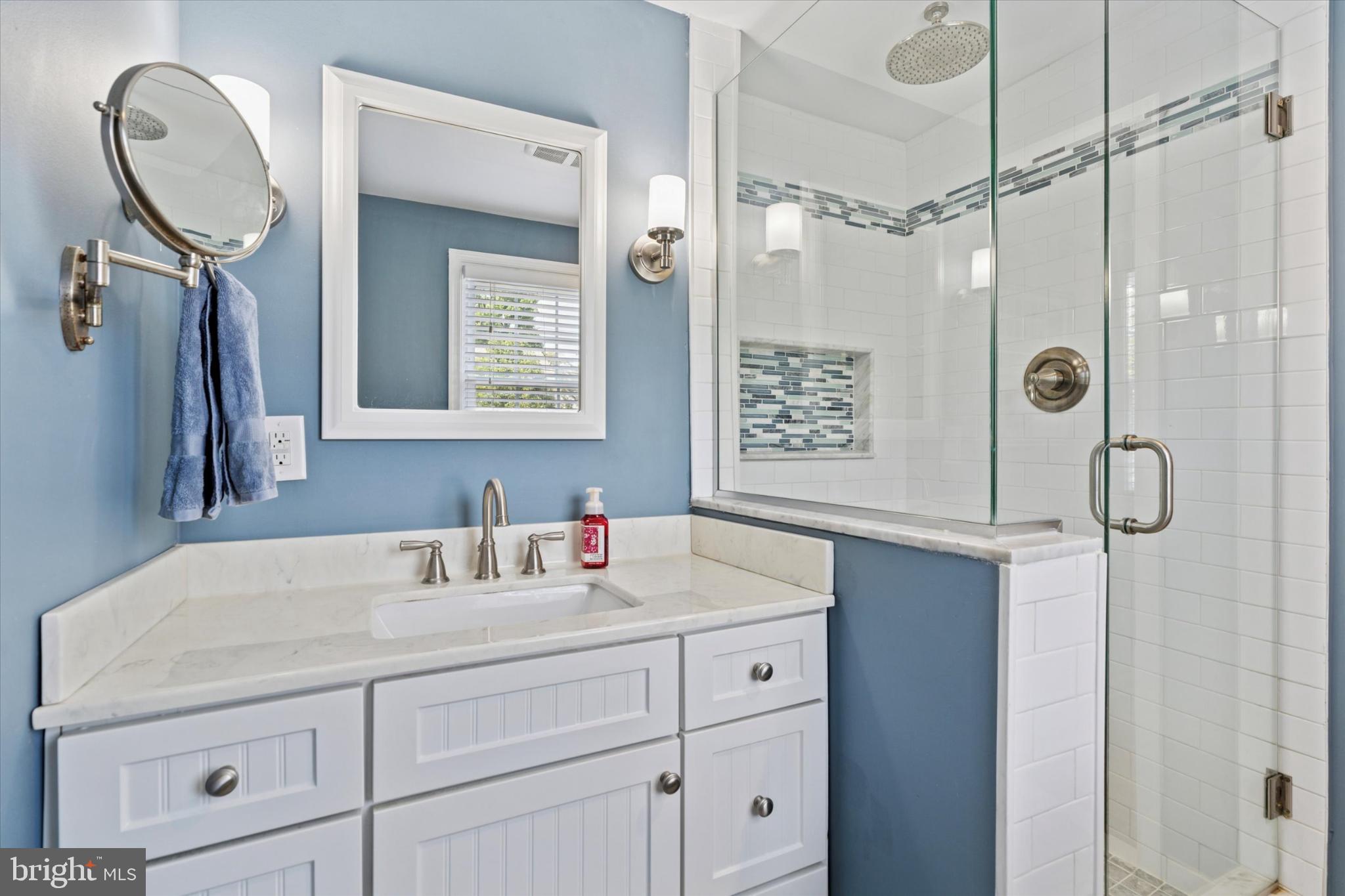 101 Rockland Road Havertown, PA 19083 - Photo 24 of 35 a bathroom with a sink a vanity and a mirror