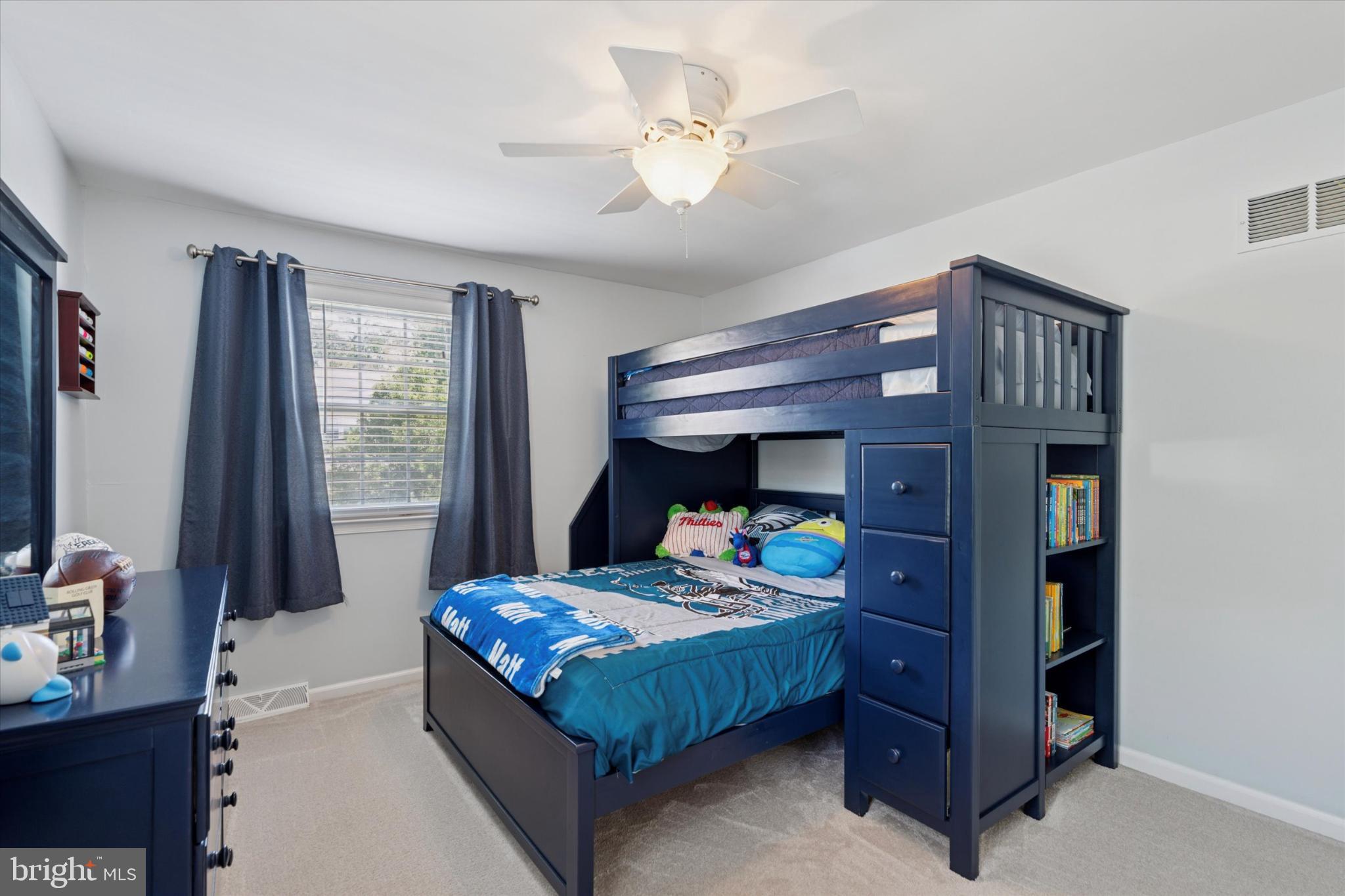 101 Rockland Road Havertown, PA 19083 - Photo 27 of 35 a bedroom with a bed and a chandelier