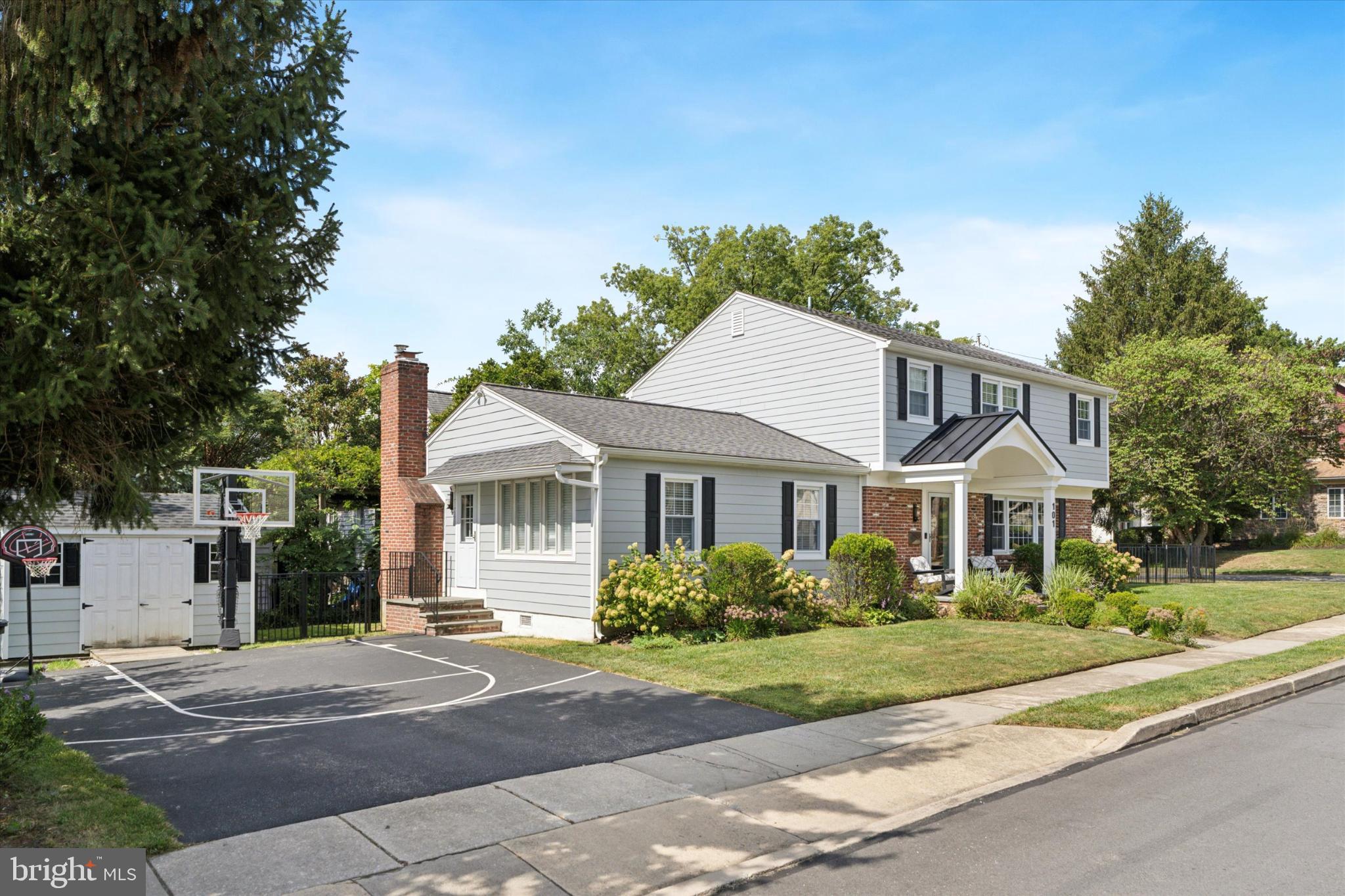 101 Rockland Road Havertown, PA 19083 - Photo 3 of 35 a front view of a house with a garden
