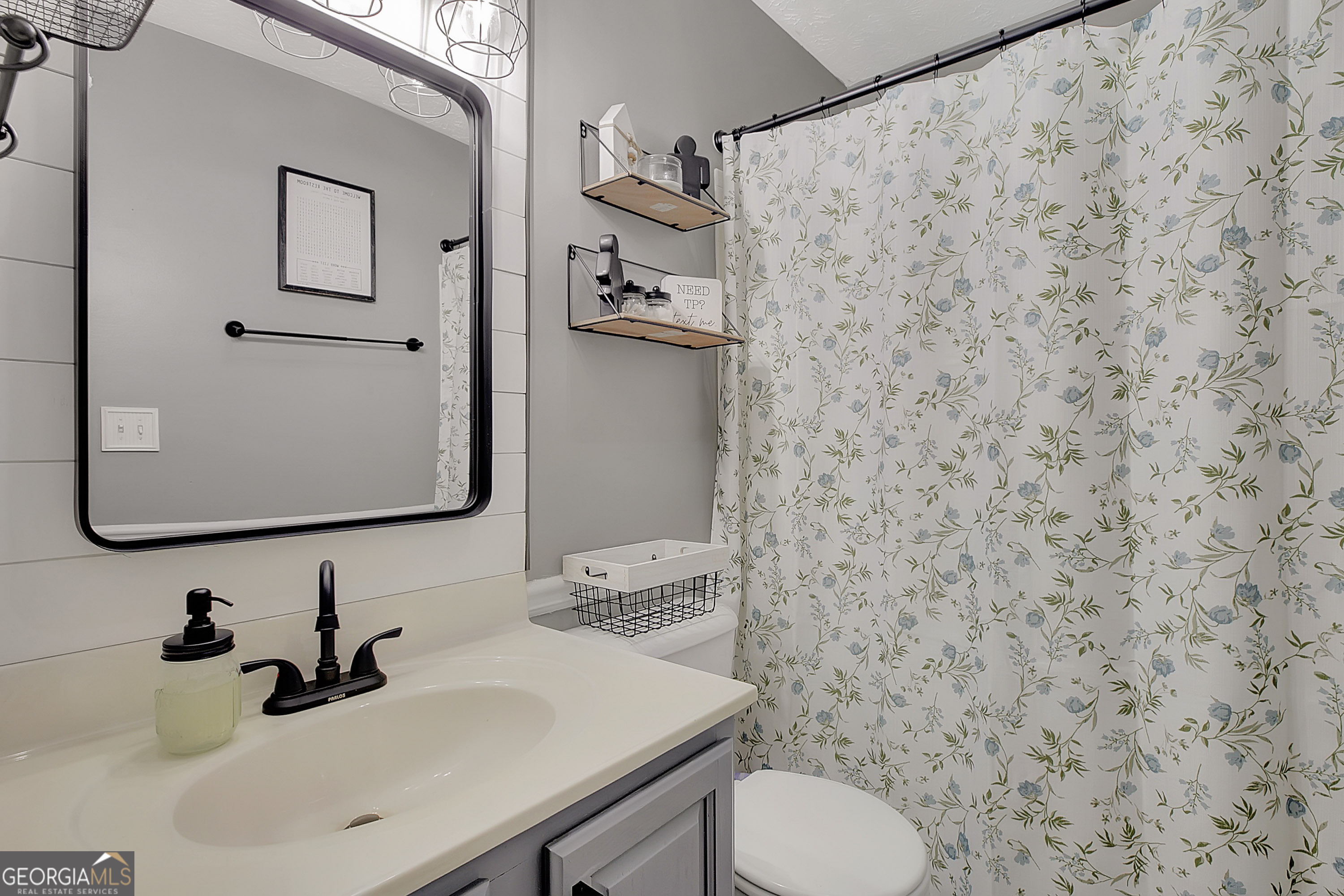 229 John Lovelace Road LaGrange, GA 30241 - Photo 37 of 59 a bathroom with a sink and a mirror
