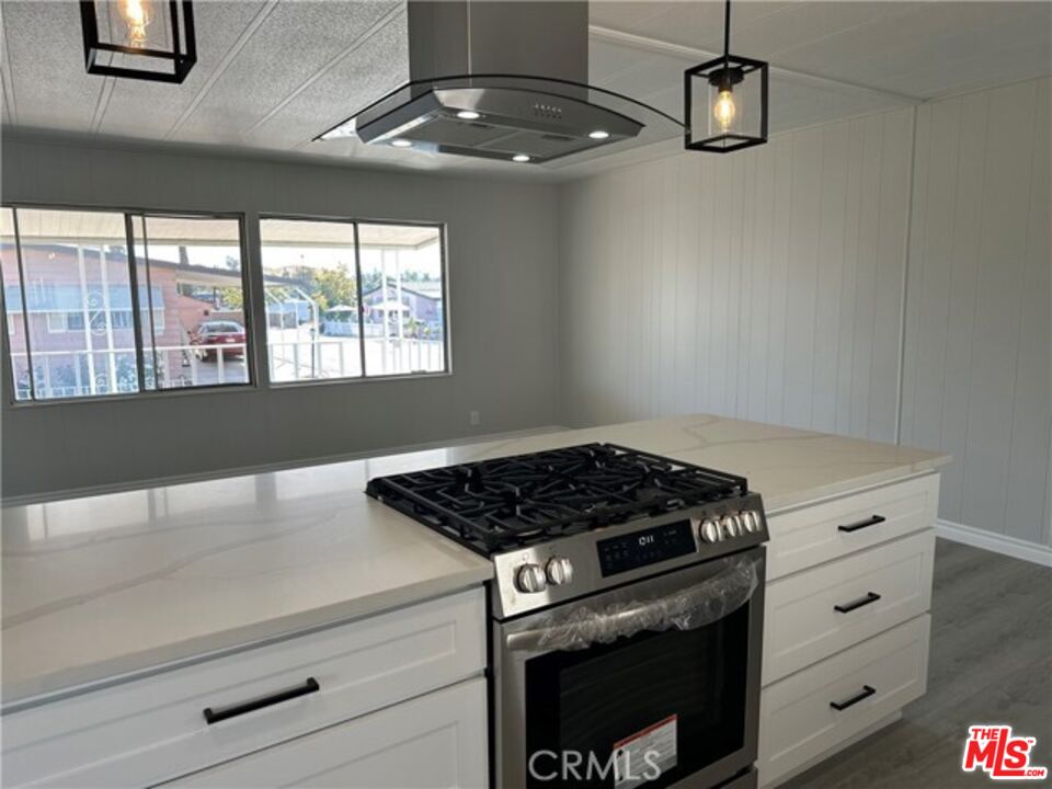 9391 California Avenue, Unit 89 Riverside, CA 92503 - Photo 4 of 16 a stove top oven sitting inside of a kitchen