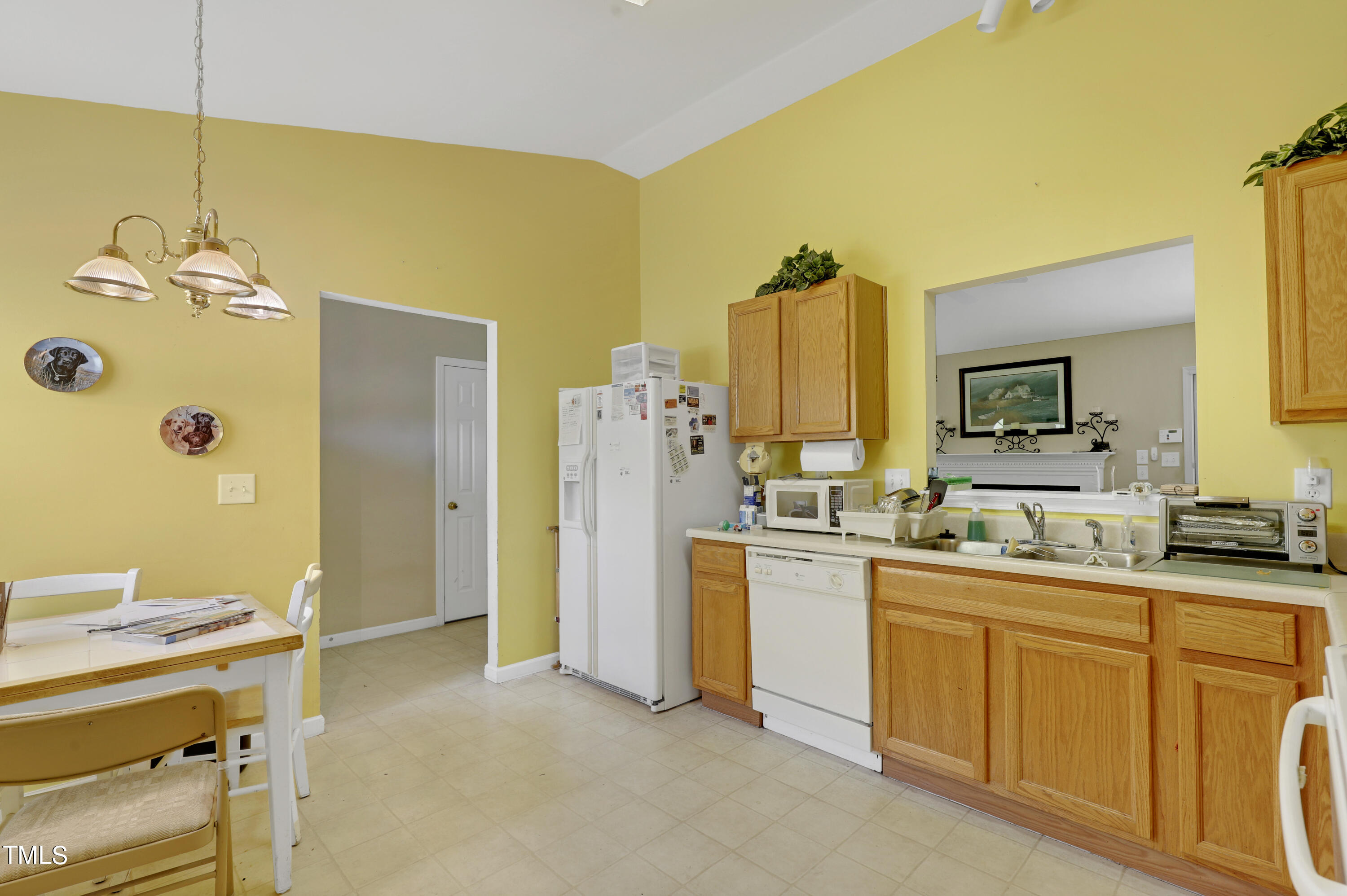 3809 Buck Ridge Court Raleigh, NC 27616 - Photo 6 of 10 a kitchen with a sink and refrigerator