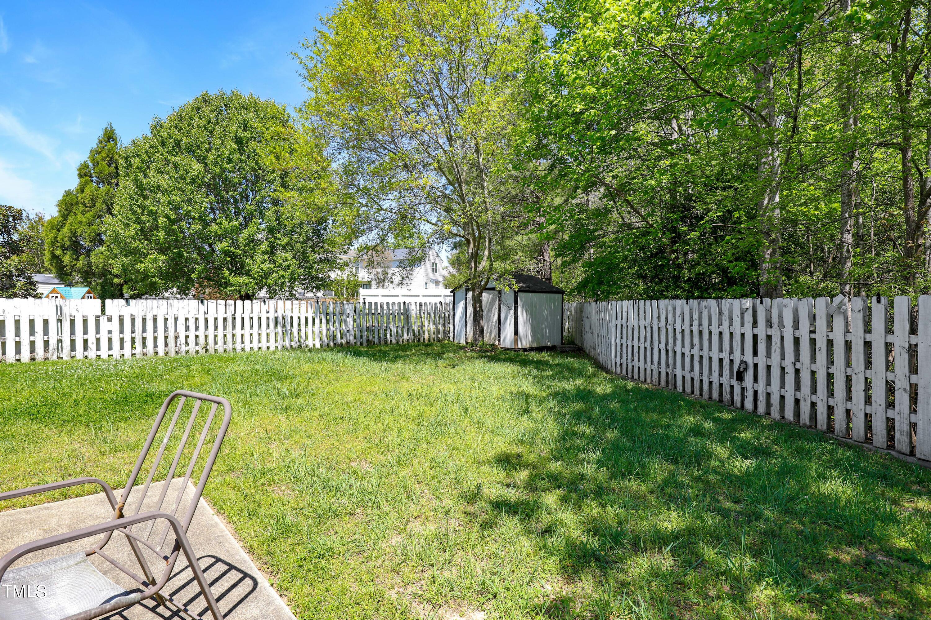3809 Buck Ridge Court Raleigh, NC 27616 - Photo 7 of 10 a view of a chair and table in the backyard