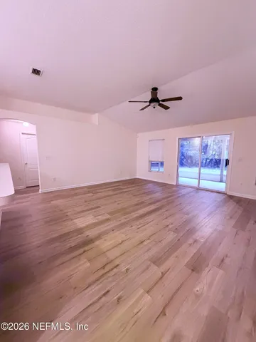 a view of an empty room with a window