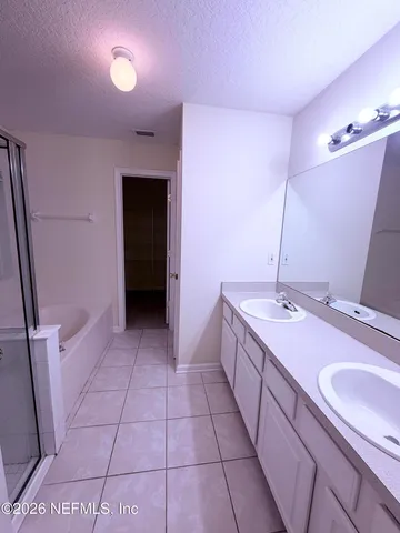 a bathroom with a sink a vanity and a mirror