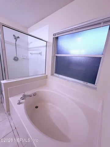 a bathroom with a sink a large mirror and a vanity