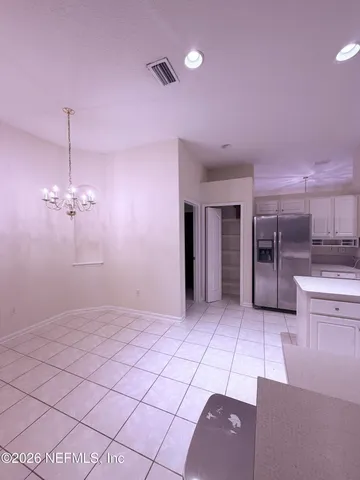 a view of a kitchen with a sink and cabinets