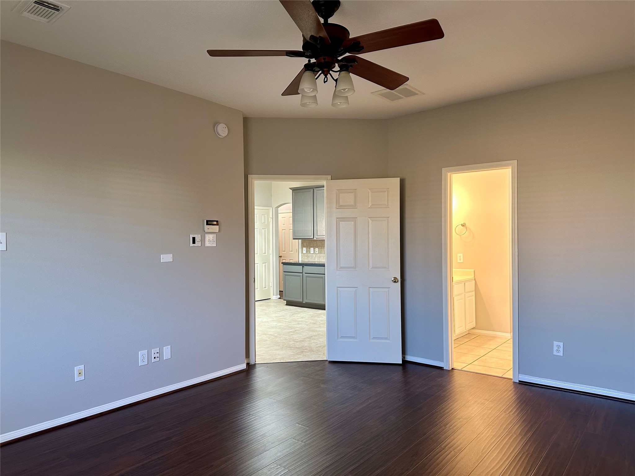 18822 Appletree Ridge Road Houston, TX 77084 - Photo 16 of 27 a view of an empty room with a window and wooden floor