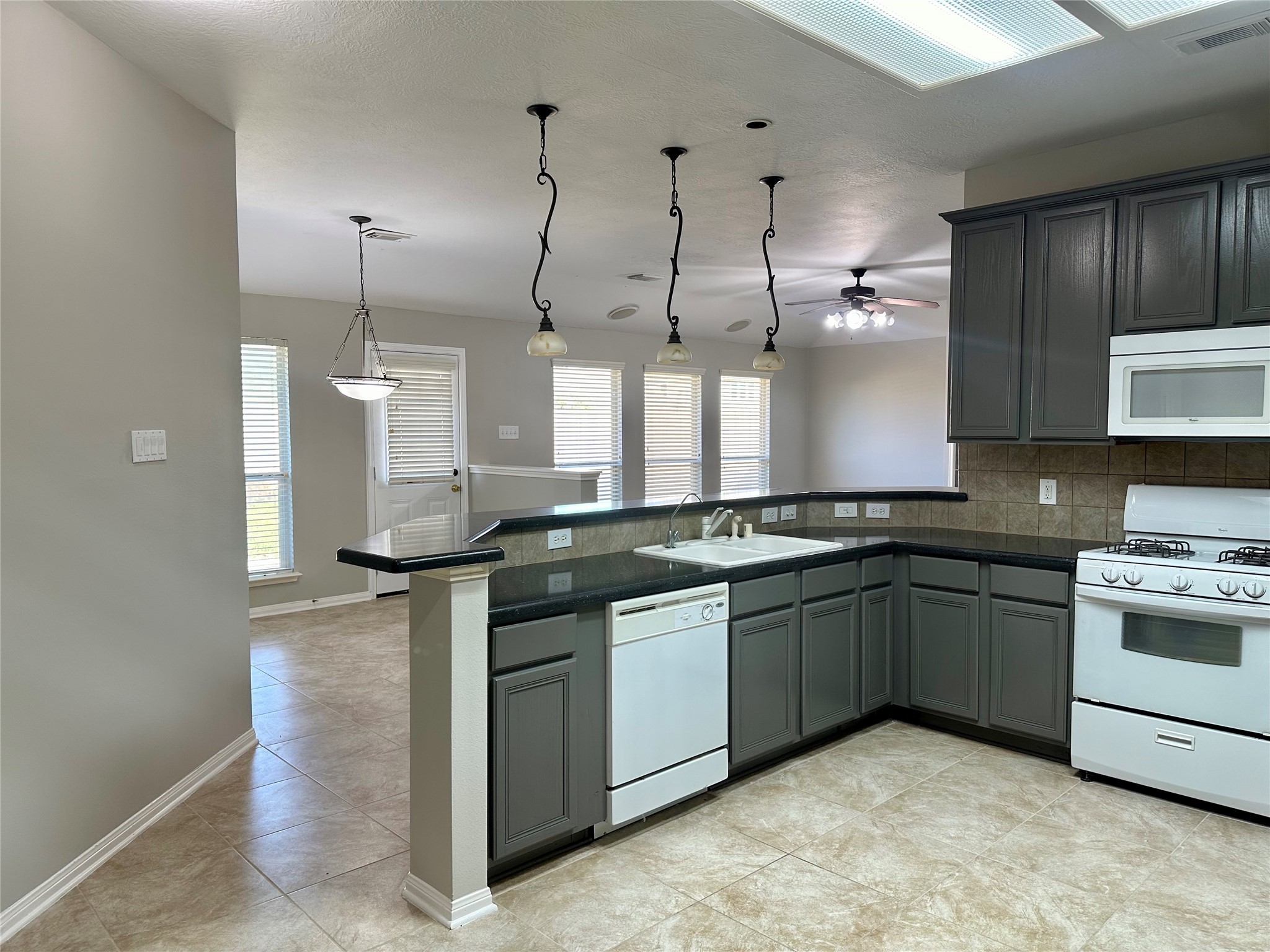 18822 Appletree Ridge Road Houston, TX 77084 - Photo 4 of 27 a kitchen with stainless steel appliances granite countertop a stove a sink and a refrigerator