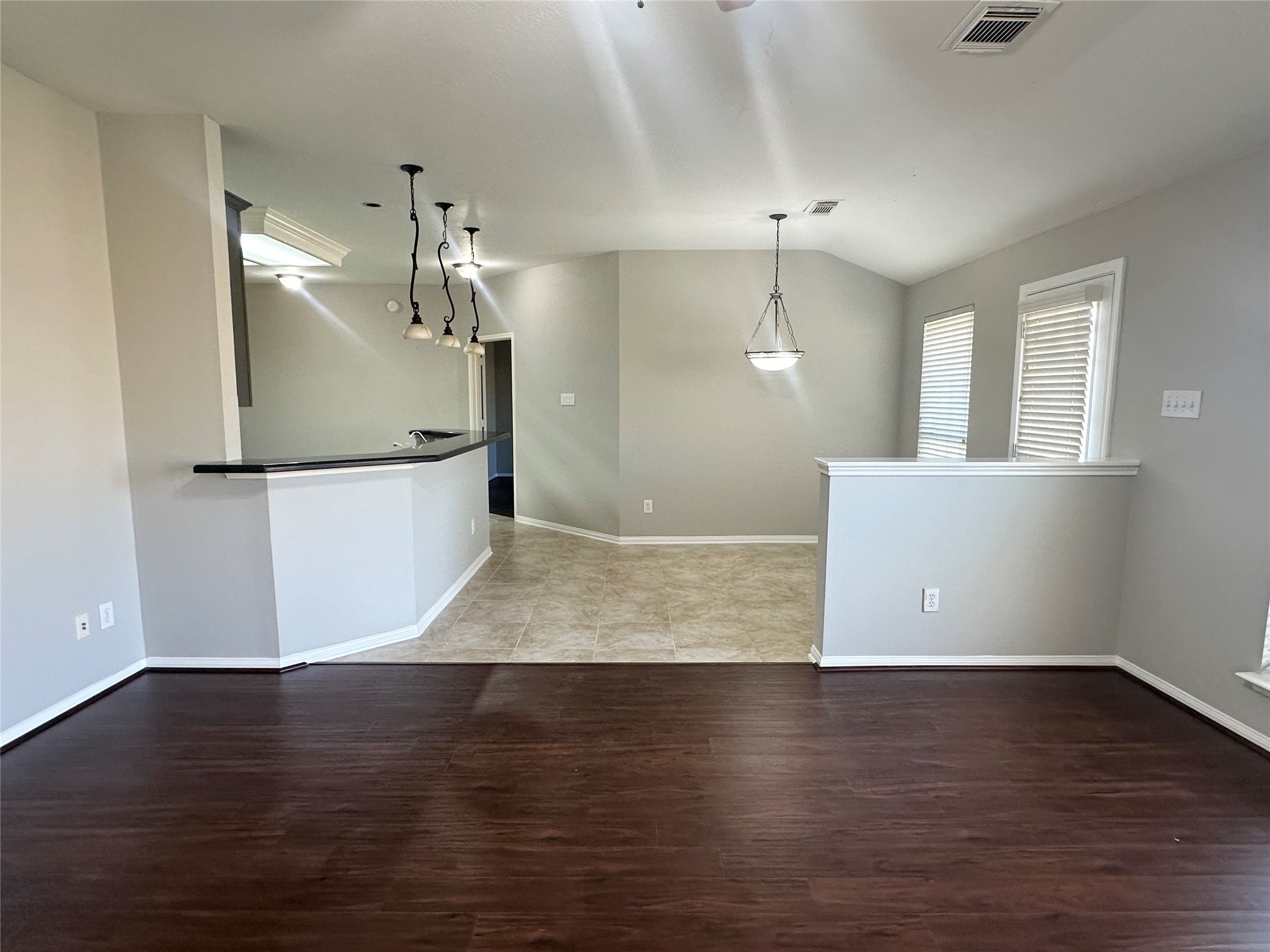 18822 Appletree Ridge Road Houston, TX 77084 - Photo 9 of 27 a view of a kitchen with wooden floor and staircase
