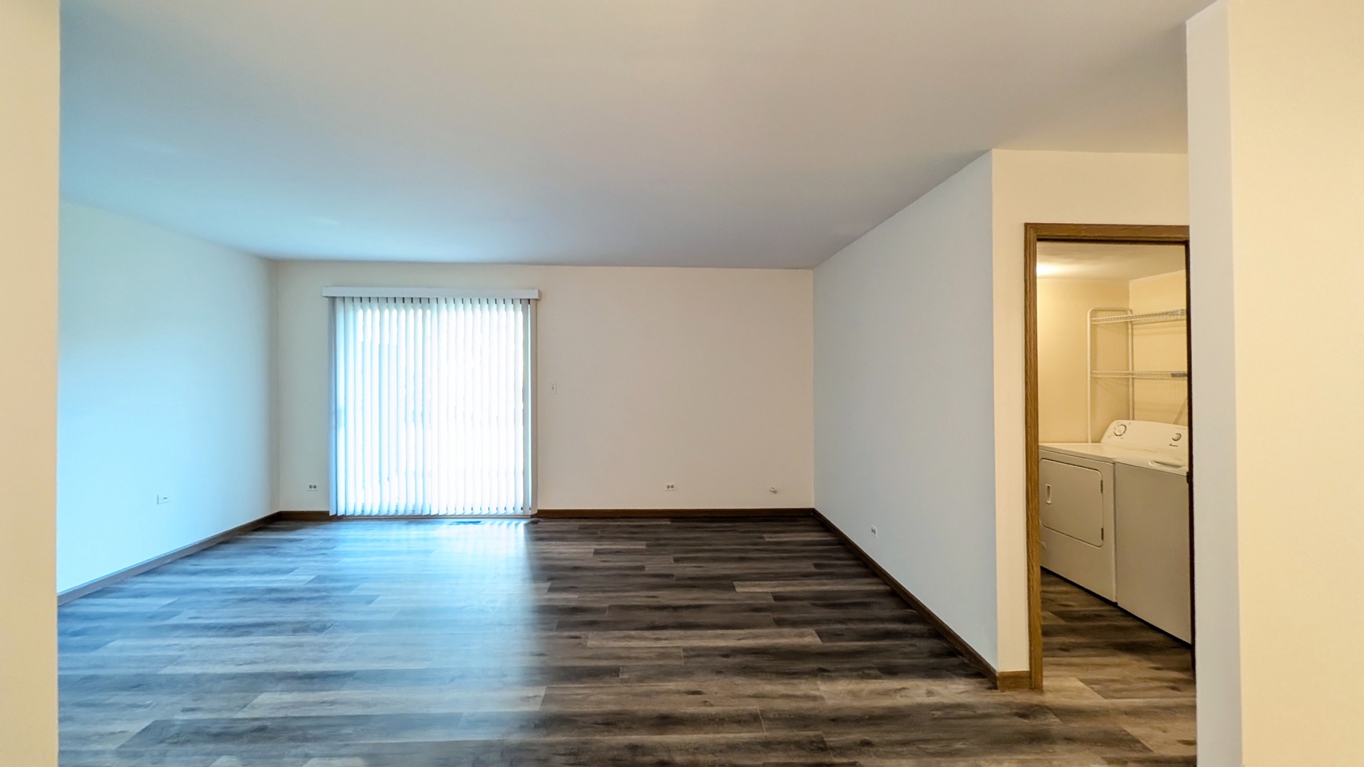 600 Crescenzo Court, Unit B New Lenox, IL 60451 - Photo 11 of 13 a view of an empty room with wooden floor and a window