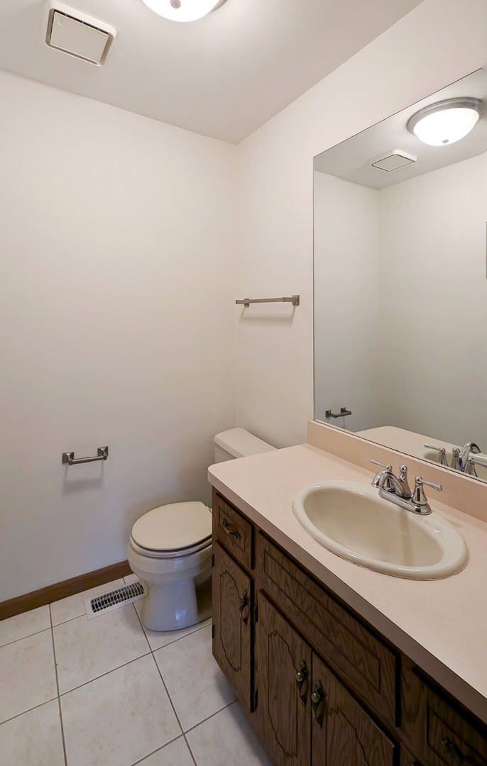 600 Crescenzo Court, Unit B New Lenox, IL 60451 - Photo 5 of 13 a bathroom with a sink and a toilet
