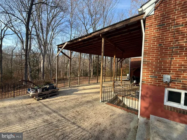 a view of backyard with sitting area