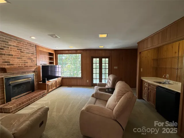 a living room with furniture window and a fireplace